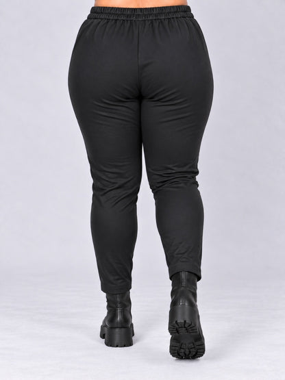 Rückseite der schwarzen Leggings aus Jersey mit elastischem, gerafftem Bund, Rückansicht