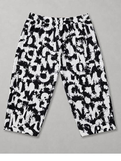 Sinne by Coom 7/8-Hose Schwarz-Weiß Buchstaben-Print Große Größen